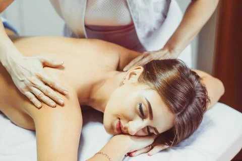 A back massage in the salon Stock Photos