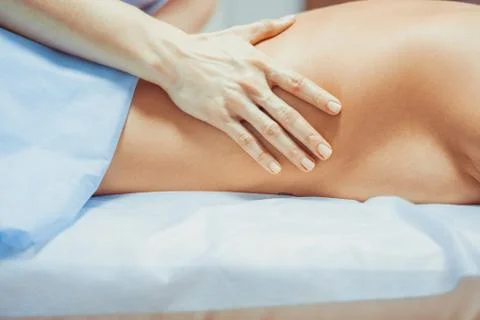 A back massage in the salon Stock Photos