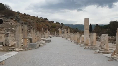 Back Moving Along The Ancient City Street With The Ruins Of Many Stone Columns Stock Footage 195930736