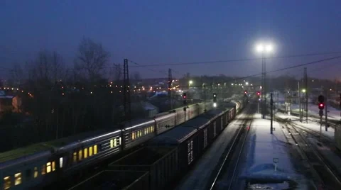 Back of moving long freight train on railway at winter evening Stock Footage 52450774