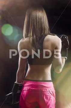 Back muscled young female boxer, fitness Stock Photos