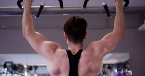 Back Muscles Flex During Pull Ups on the Gym Pull Up Bar Stock Footage 340226553