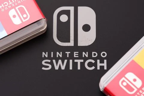 Back of Nintendo Switch video game console with video game cartridge boxes Stock Photos