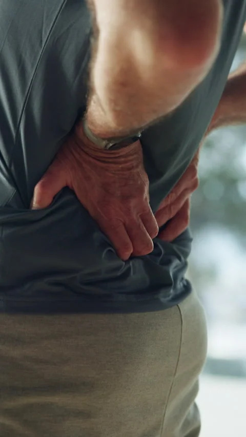 Back pain, crisis and hands of old man in home for fibromyalgia, injury Stock Footage 319871658