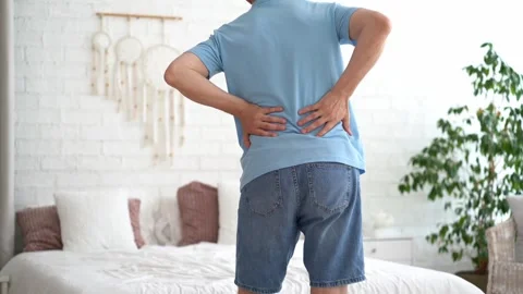 Back pain, kidney inflammation, man suffering from backache at home Stock Footage 280933196