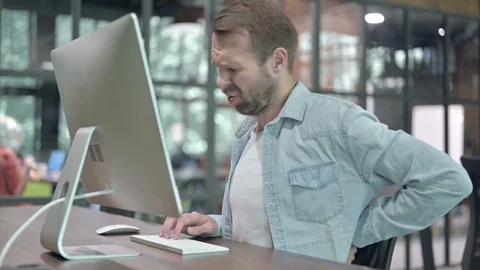 Back Pain, Uncomfortable Man Working on Computer at Work Stock Footage 116093249