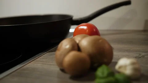 Back pan through natural vegetables, mushrooms, tomato, garlic and basil Stock Footage