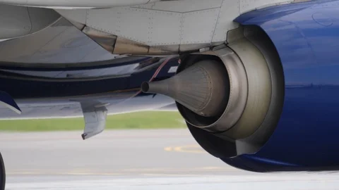 Back part of jet airliner engine. Aircraft moves on taxiway at airport. Stock Footage 94514038