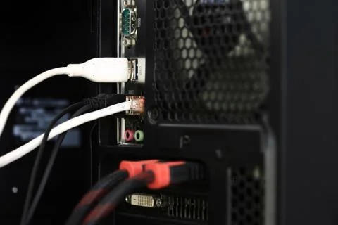 Back of a pc computer. socket connect with multiple ports. many USB cables an Stock Photos