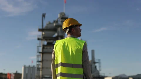 Back of Professional Heavy Industry Engineer, Worker Wearing Safety Uniform Stock Footage 229360357