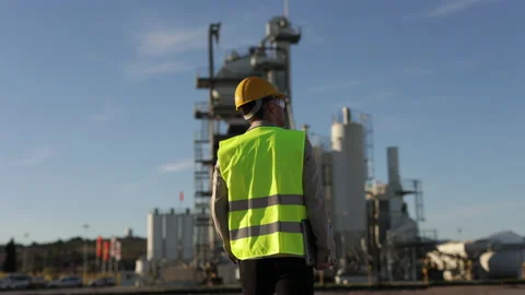Back of Professional Heavy Industry Engineer, Worker Wearing Safety Uniform Video stock 230979582