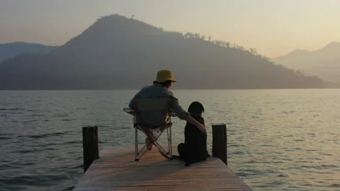 Back rear view couple enjoy beauty calm view in budget travel tourism. 動画素材 173574335