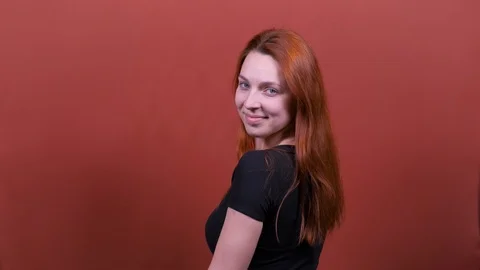 Back rear view redhead young woman. looking camera fluttering waving long health Stock Footage 122951090