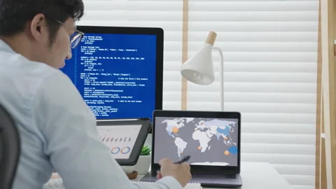 Back rear view of young asian man, freelance data scientist work remotely Stock Footage 142896944