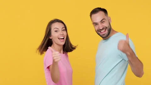 Back rear view young smiling fun couple friends woman man 20s in basic t-shirts Stock Footage 148322382