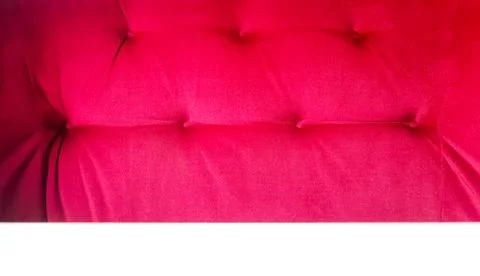 Back of a red sofa. Red fabric texture background, Chesterfield style decoration Stock Photos