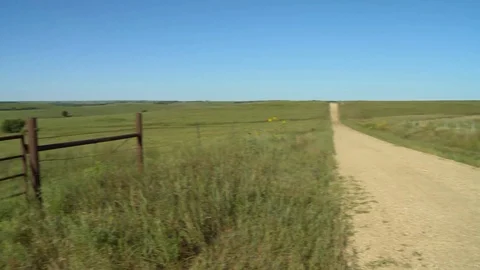 Back Road and farm gate Kansas Flint Hills Stock Footage 114987844