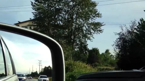 Back road reflected in car mirror Stock Footage 53098316
