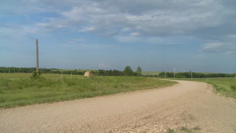 Back road with storm clouds pan Stock Footage 136204443