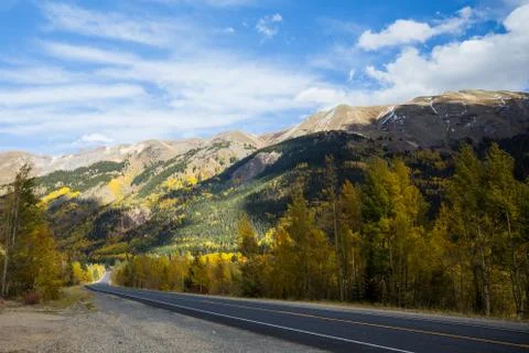 Back road through mountains with changing trees of Colorado Stock Photos