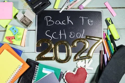 Back To School 2027 Flat Lay With Chalkboard, Notebooks, Pens and Colorful Suppl Stock Photos