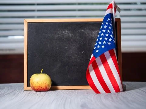 Back to school with American flag chalk black board Stock Photos