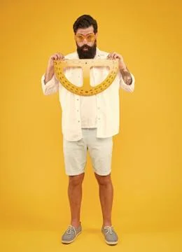 Back to school and back to maths. School teacher holding measuring instruments Stock Photos