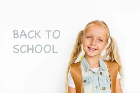 Back to school and happy time. Cute child with blonde hair on white background Stock Photos