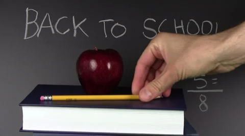 Back to school apples and blackboard - HD Stock Footage 5299169