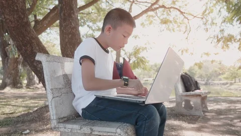 Back to School. asian boy using his laptop to learning online. Stock Footage 127180807
