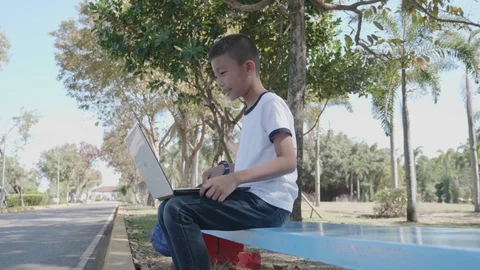 Back to School. asian boy using his laptop to learning online. Stock Footage 127184637