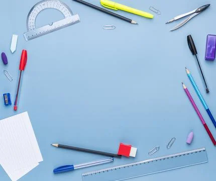 Back to school backdrop. School supply over light blue background with copy.. Stock Photos