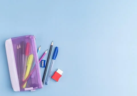 Back to school backdrop. School supply over light blue background with copy.. Stock Photos