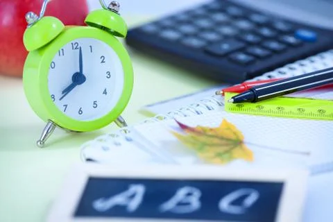 Back to School Background with Alarm Clock and Maple Leaf Stock Photos