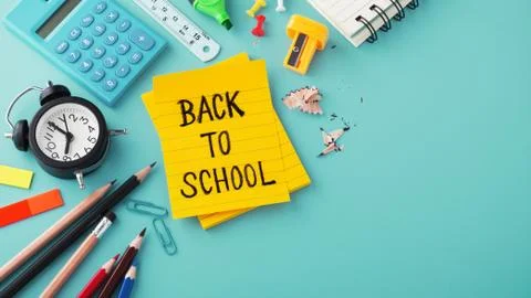 Back to school background with calculator, clock and school supplies Stock Photos
