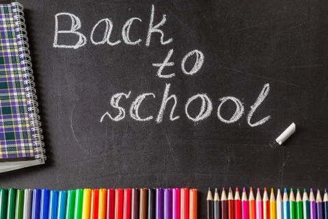 Back to school background with colorful felt tip pens, pencils, notebook and the Stock Photos