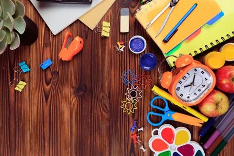 Back to School background concept. School supplies on a wooden background. Ed Stock Photos