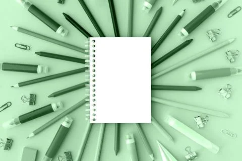 Back to school background with opened notepad and variety of school supplies in Stock Photos