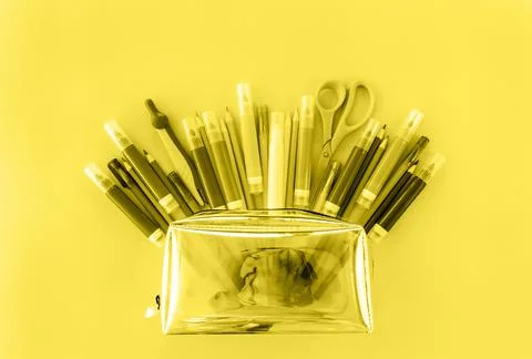 Back to school background with opened pencil case with variety of school supp Stock Photos