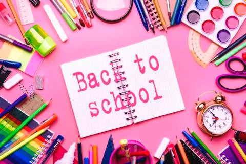 Back to school background with printed text, notebooks, pens, pencils, other Stock Photos