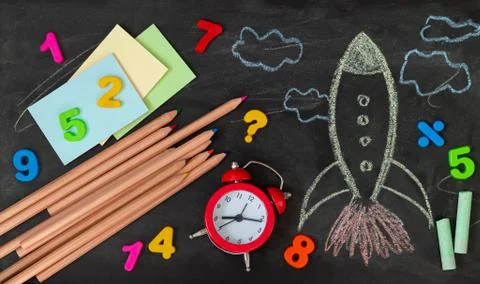 Back to school background with rocket and education supplies top view Stock Photos