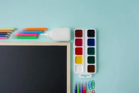Back to school background with school accessories on a blue background Stock Photos