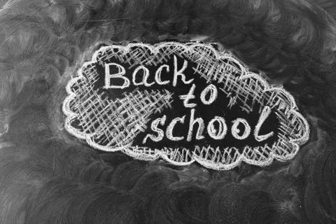 Back to school background with title "Back to school" written by white chalk on Stock Photos