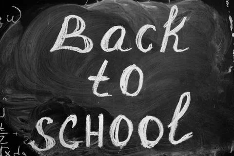 Back to school background with title "Back to school" written by white chalk on Stock Photos