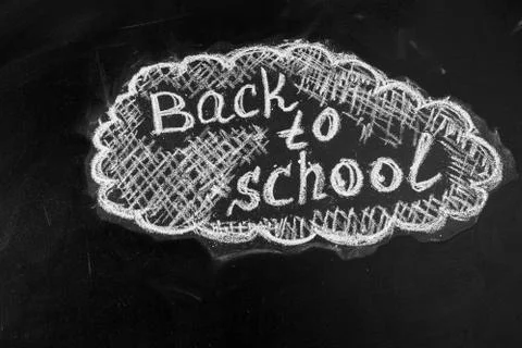 Back to school background with title "Back to school" written by white chalk on Stock Photos