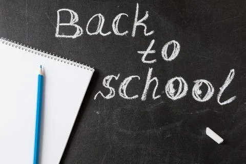 Back to school background with  title "Back to school" written by white chalk an Stock Photos
