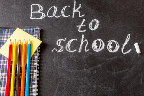 Back to school background with  title "Back to school" written by white chalk an Stock Photos