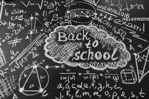 Back to school background  title "Back to school" and formulas written by whit Stock Photos