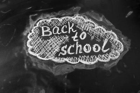 Back to school background with title "Back to school" written by white chalk on Stock Photos