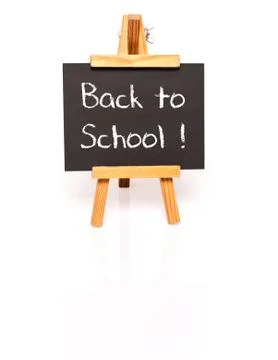 Back to school. Blackboard with text and easel. Stock Photos